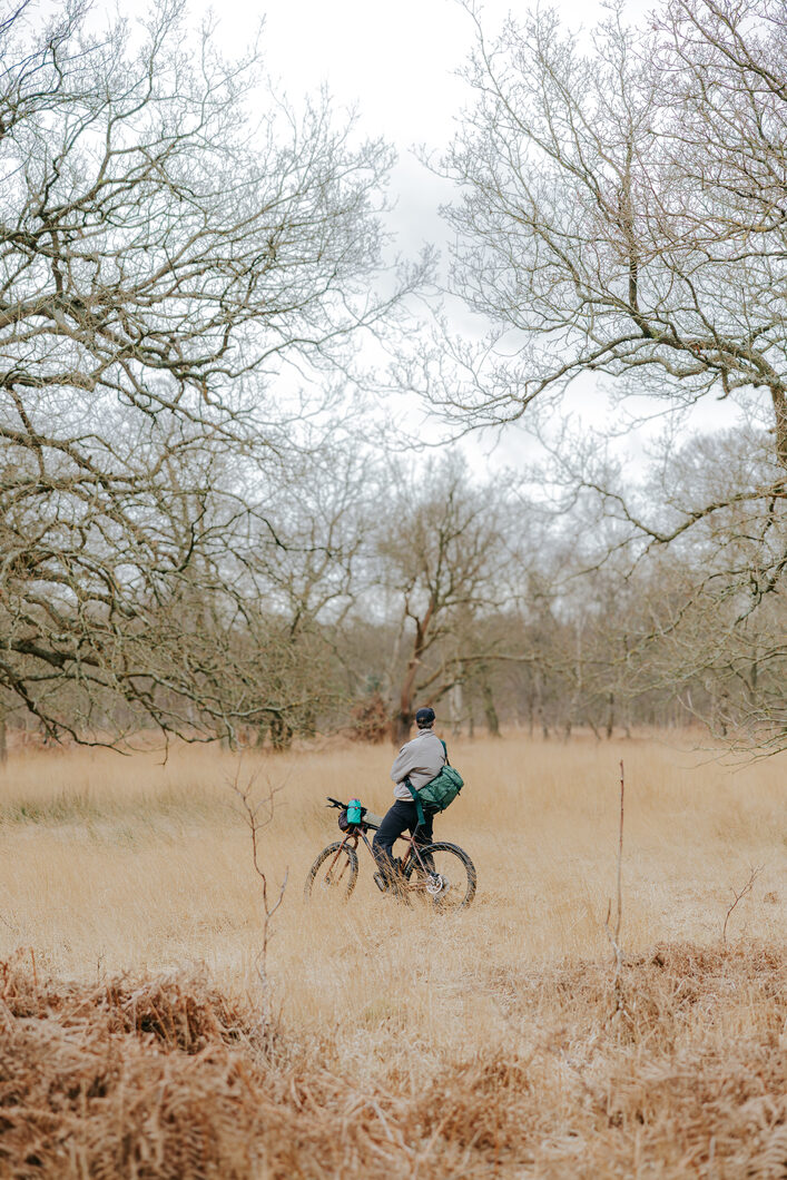 Maymana Walking through Forest with ELLIKER bag on
