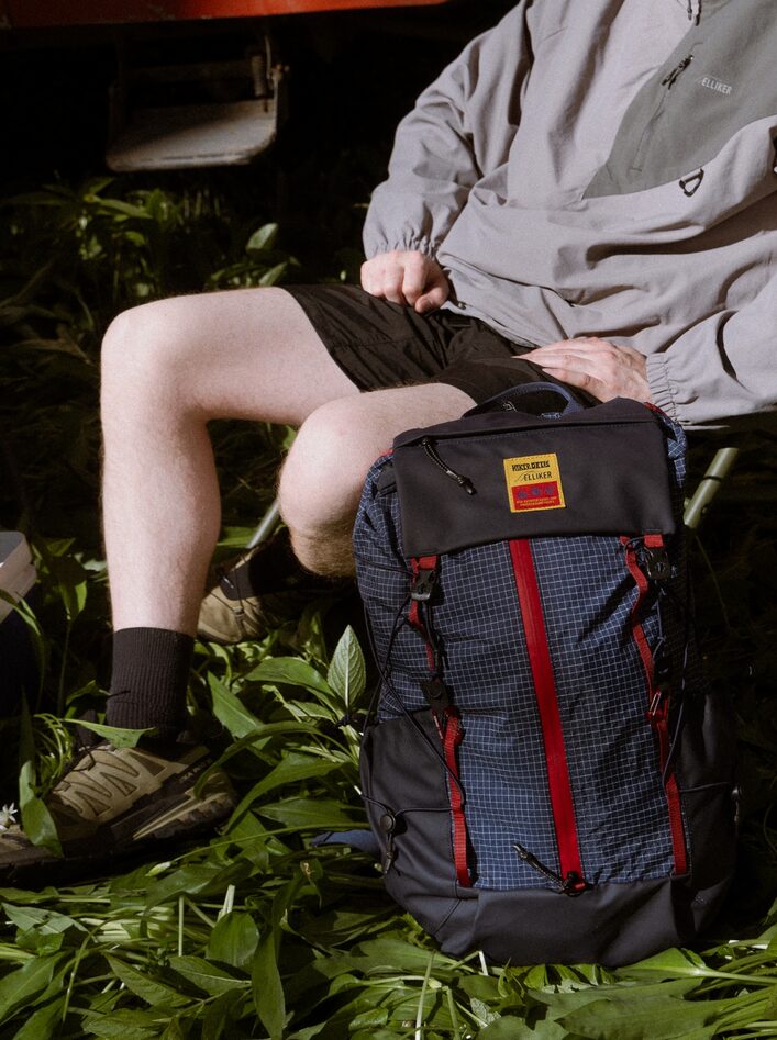 ELLIKER x Hikerdelic Cautley Flap Over Backpack next to chair