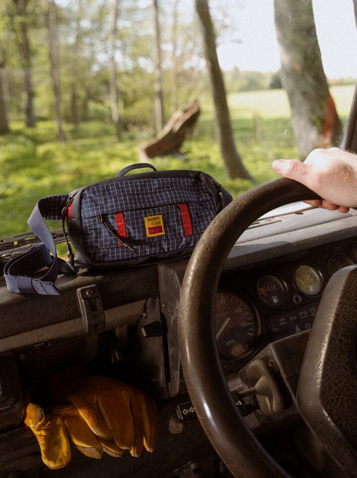ELLIKER x Hikerdelic Semer Sling Bag on landrover dashboard