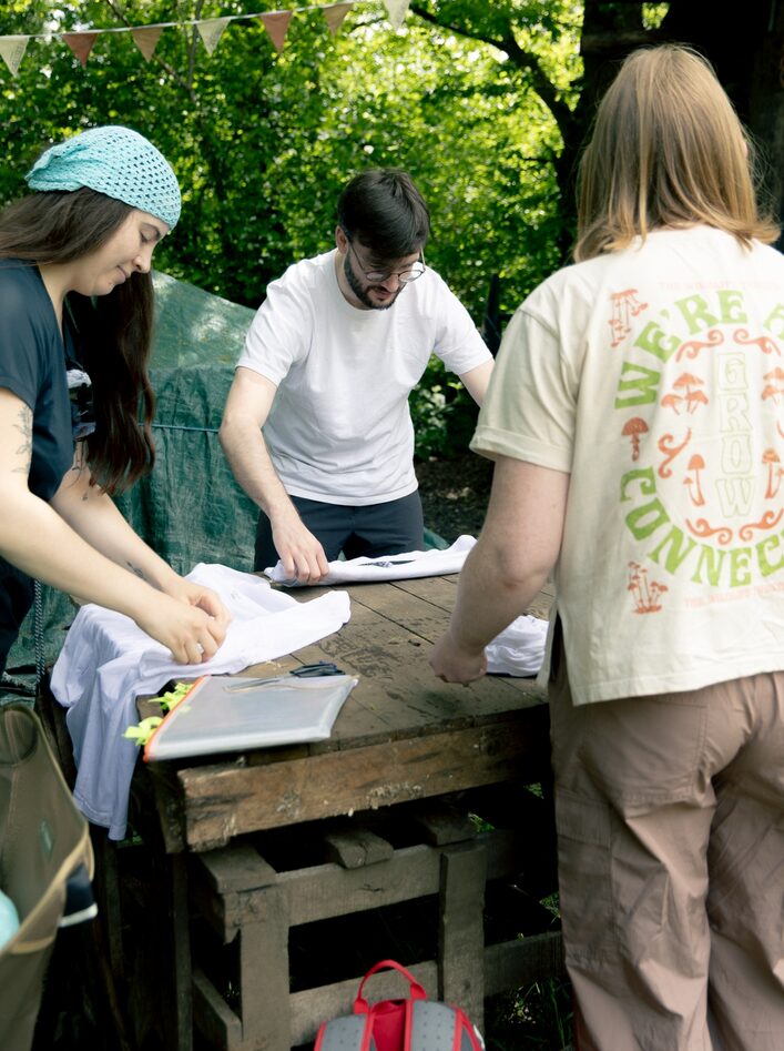 Guests fold ELLIKER Tshirts ready for Natrual Dyeing